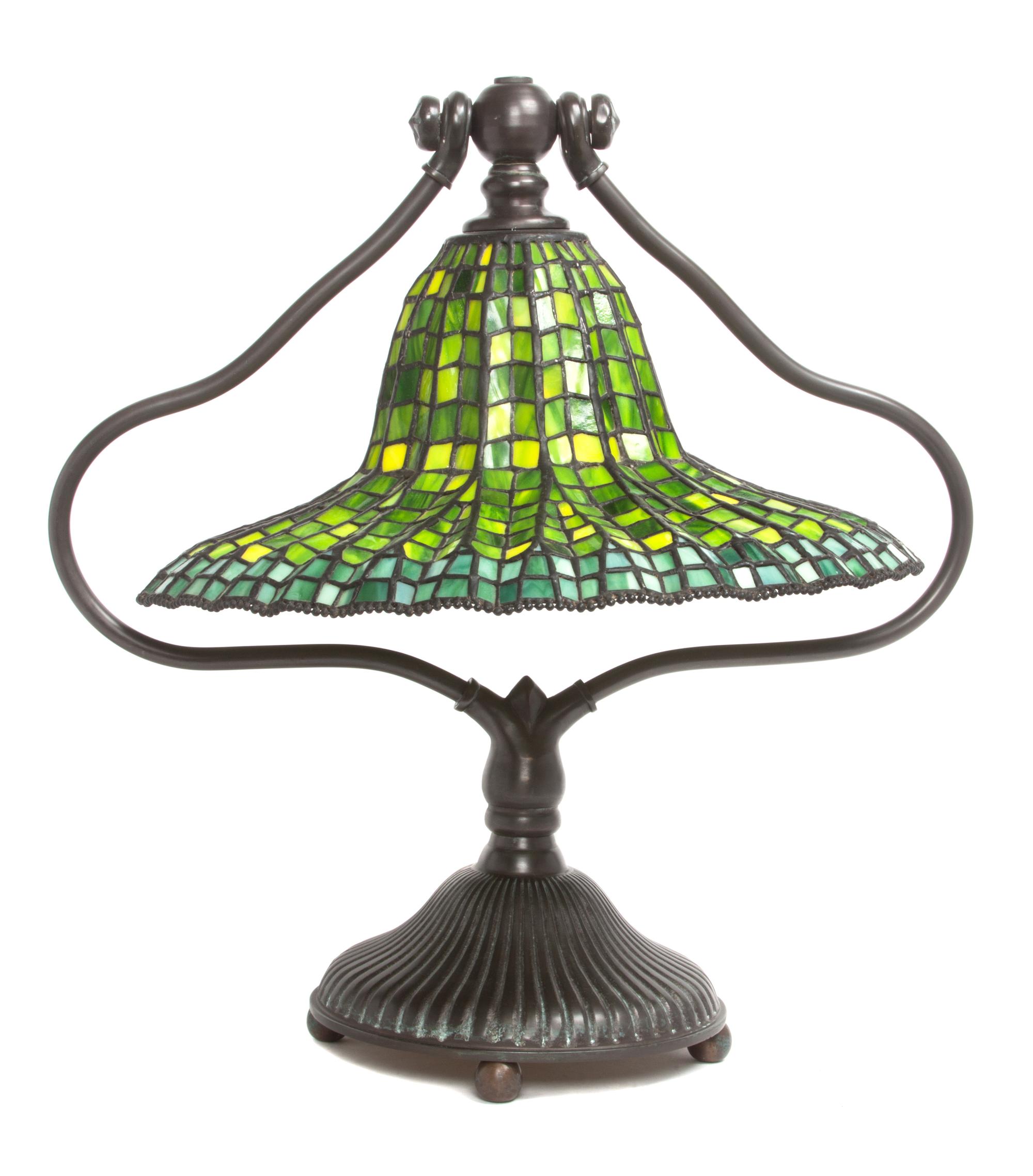 An American Leaded Glass and Bronze Table Lamp Diameter of shade 16 x height overall 20 1/2 inches.