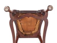 A Queen Anne Volute Carved Walnut Flat-Stretcher Pad-Foot Side Chair