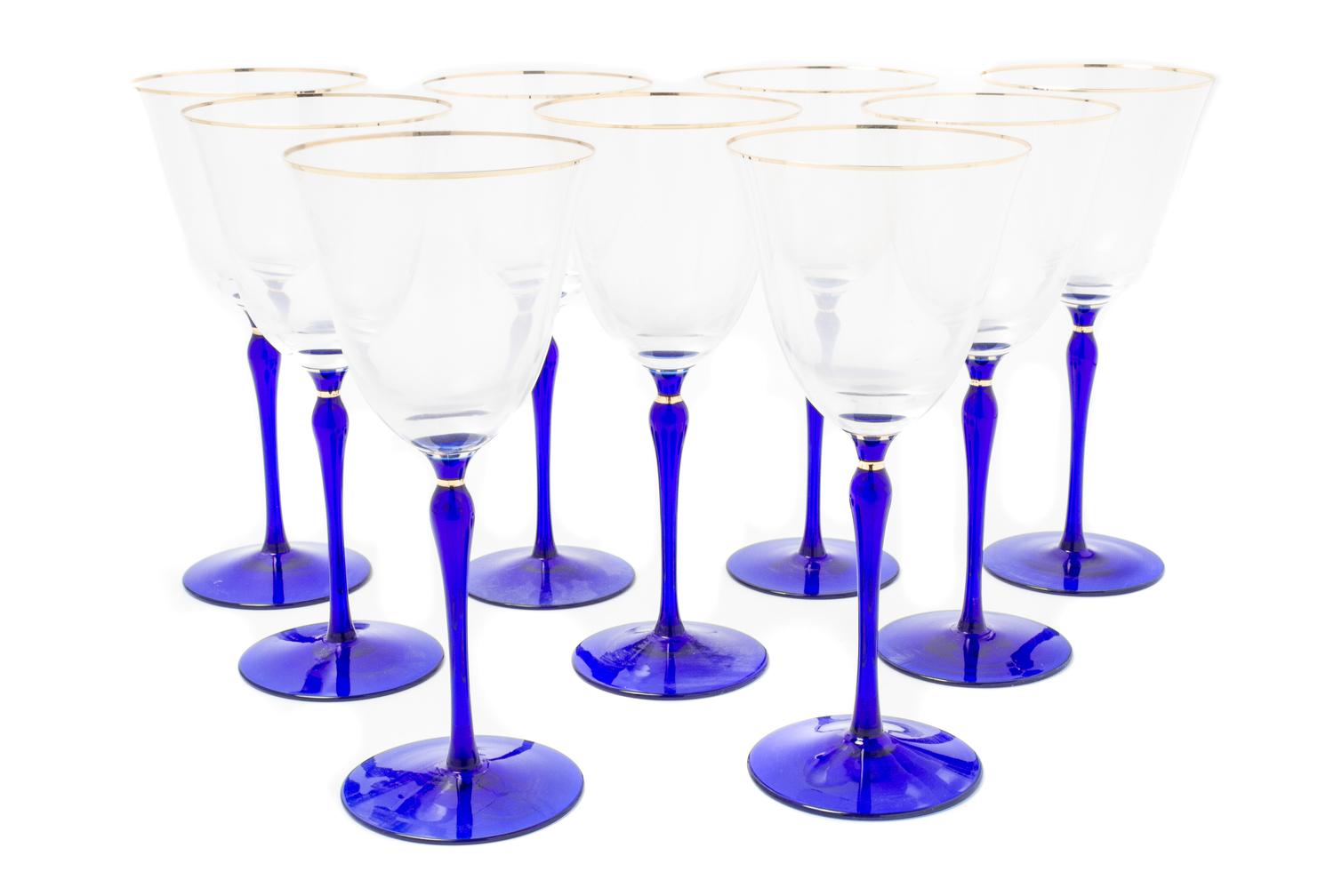 A Set of Nine Glass Wine Stems Height 8 5/8 inches.
