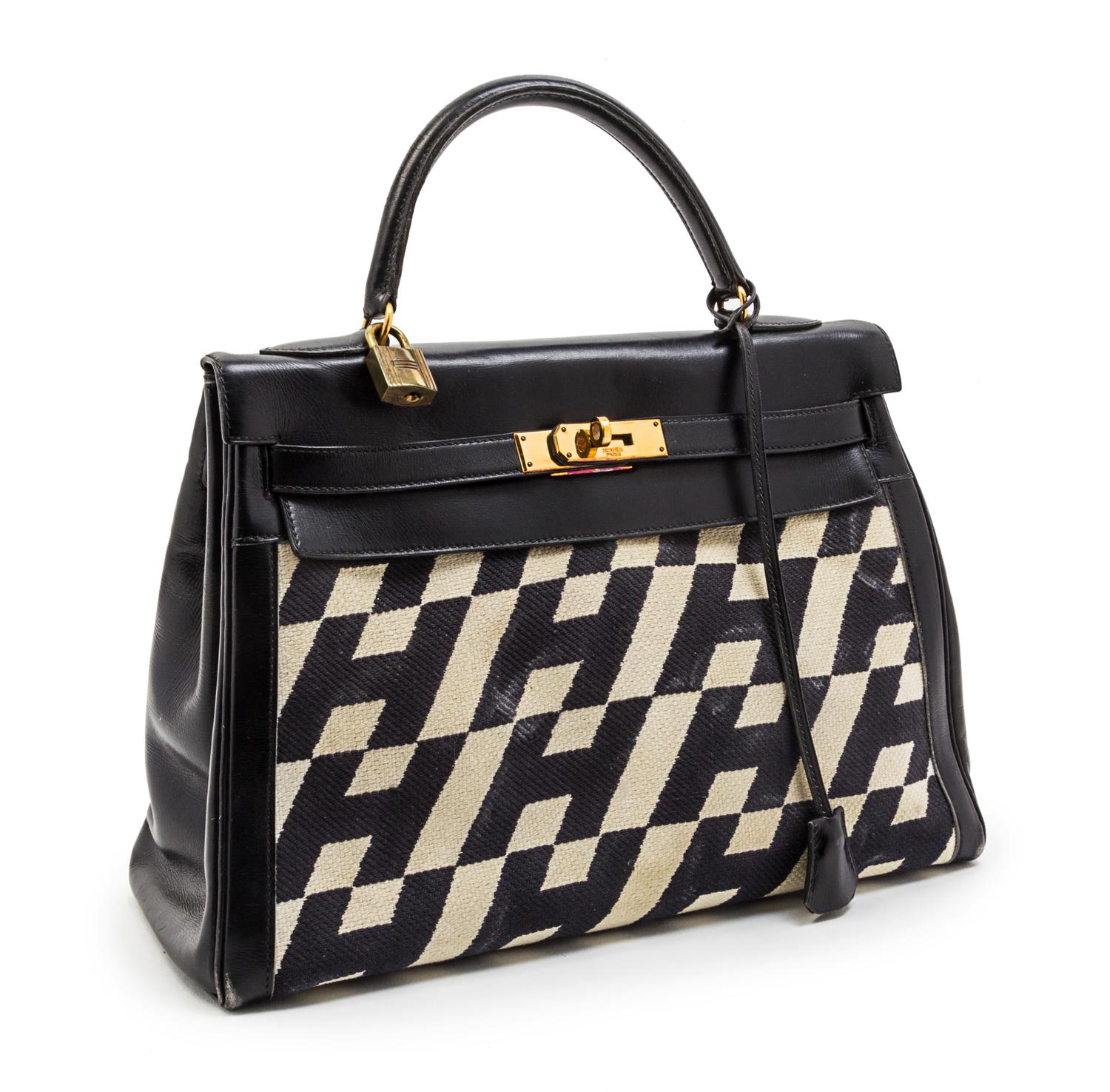 A Rare Hermes 35cm Ulysses Black Leather and Ivory Canvas Kelly Bag, 13 x 9 x 5 inches.