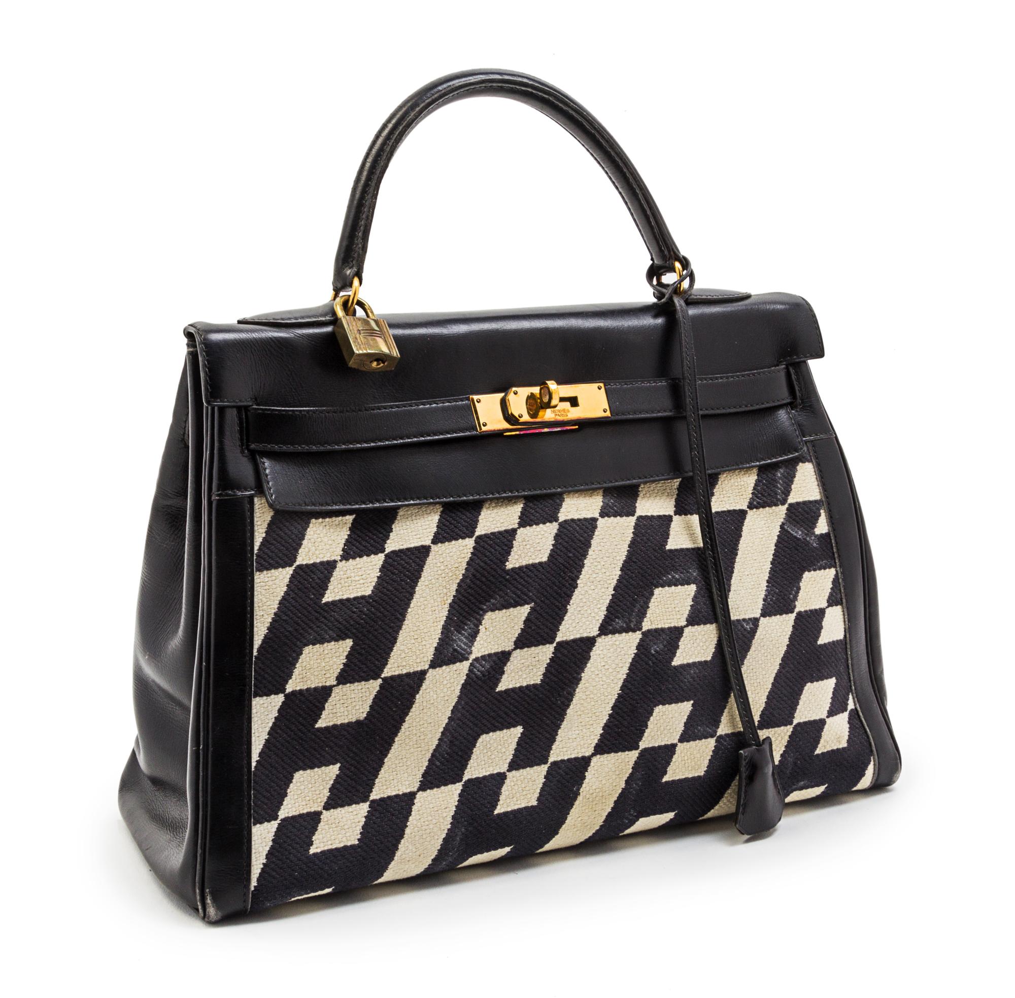 A Rare Hermes 35cm Ulysses Black Leather and Ivory Canvas Kelly Bag, 13 x 9 x 5 inches.