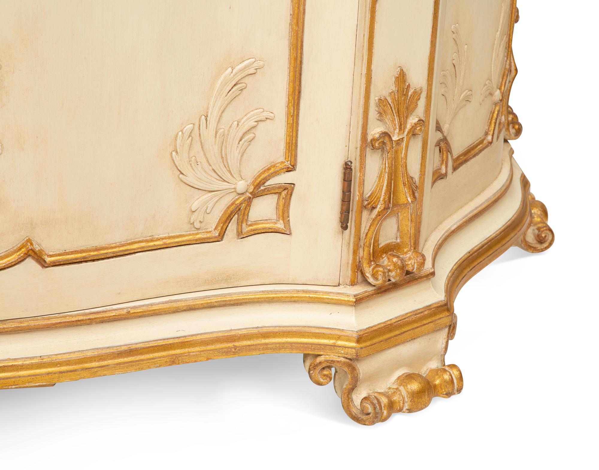 A Pair of Painted and Parcel Gilt Serpentine-Front Cabinets