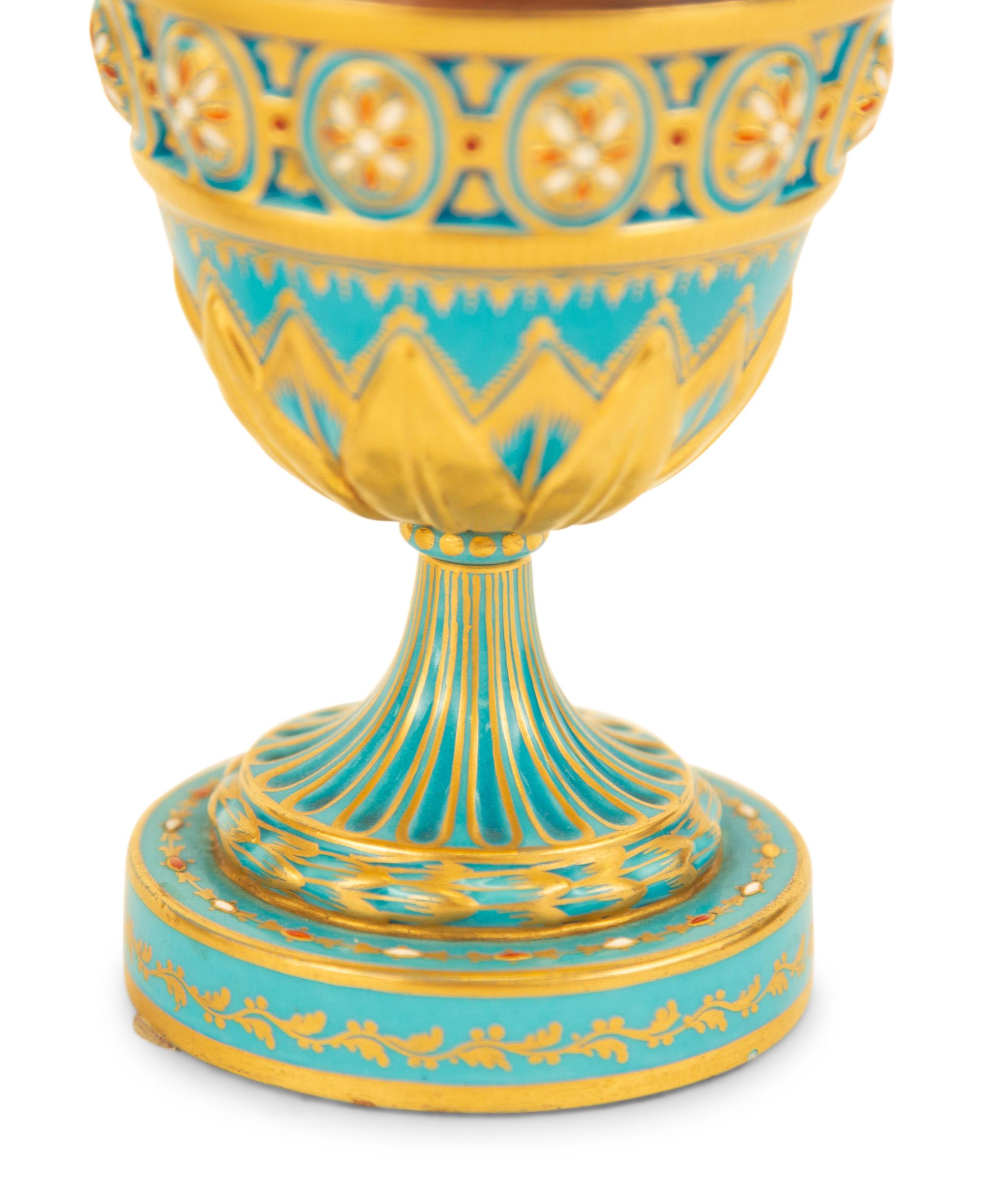 A Pair of Sèvres Style Porcelain Urns and Covers