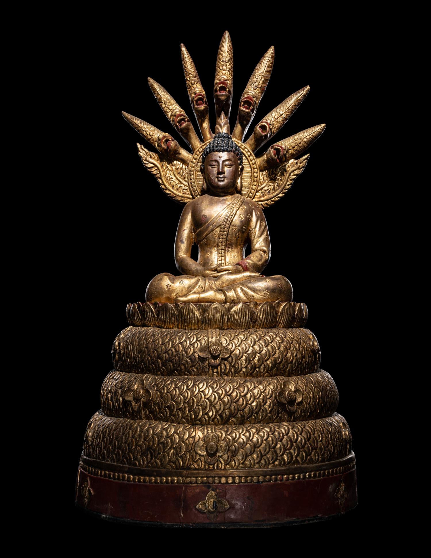 A Large Thait Gilt and Red Lacquered Wood Figure of Buddha