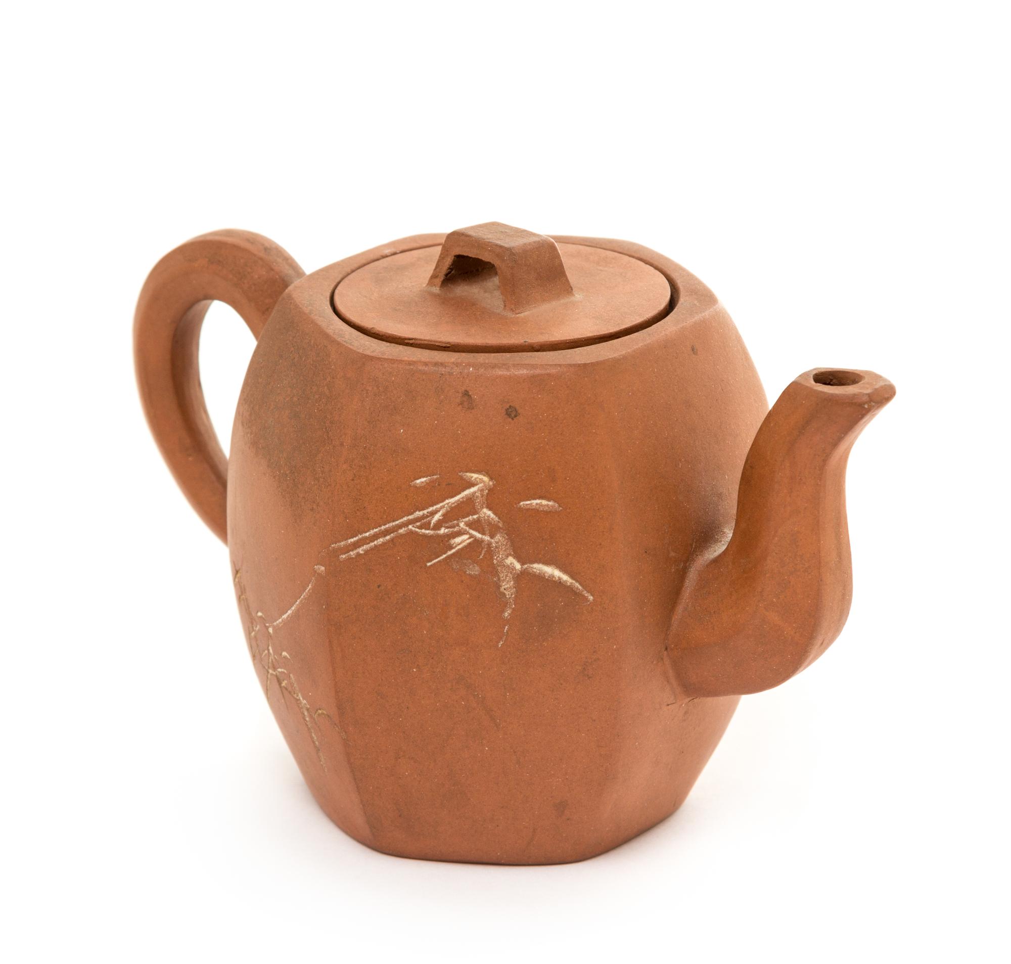 A Yixing Pottery Teapot Height 3 3/4 inches.