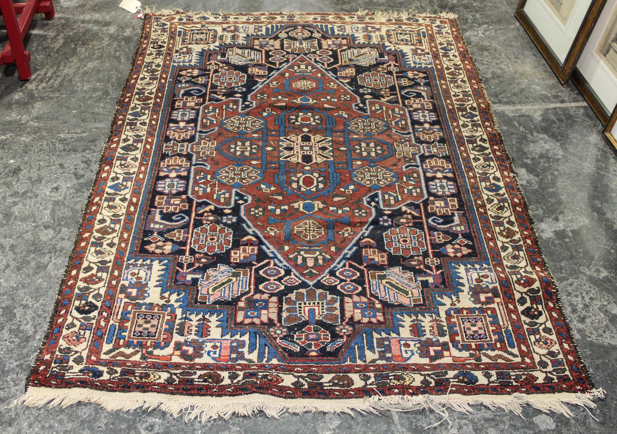 A Hamadan Wool Rug 6 feet 4 inches x 4 feet 6 1/2 inches. — CIRCA 1940