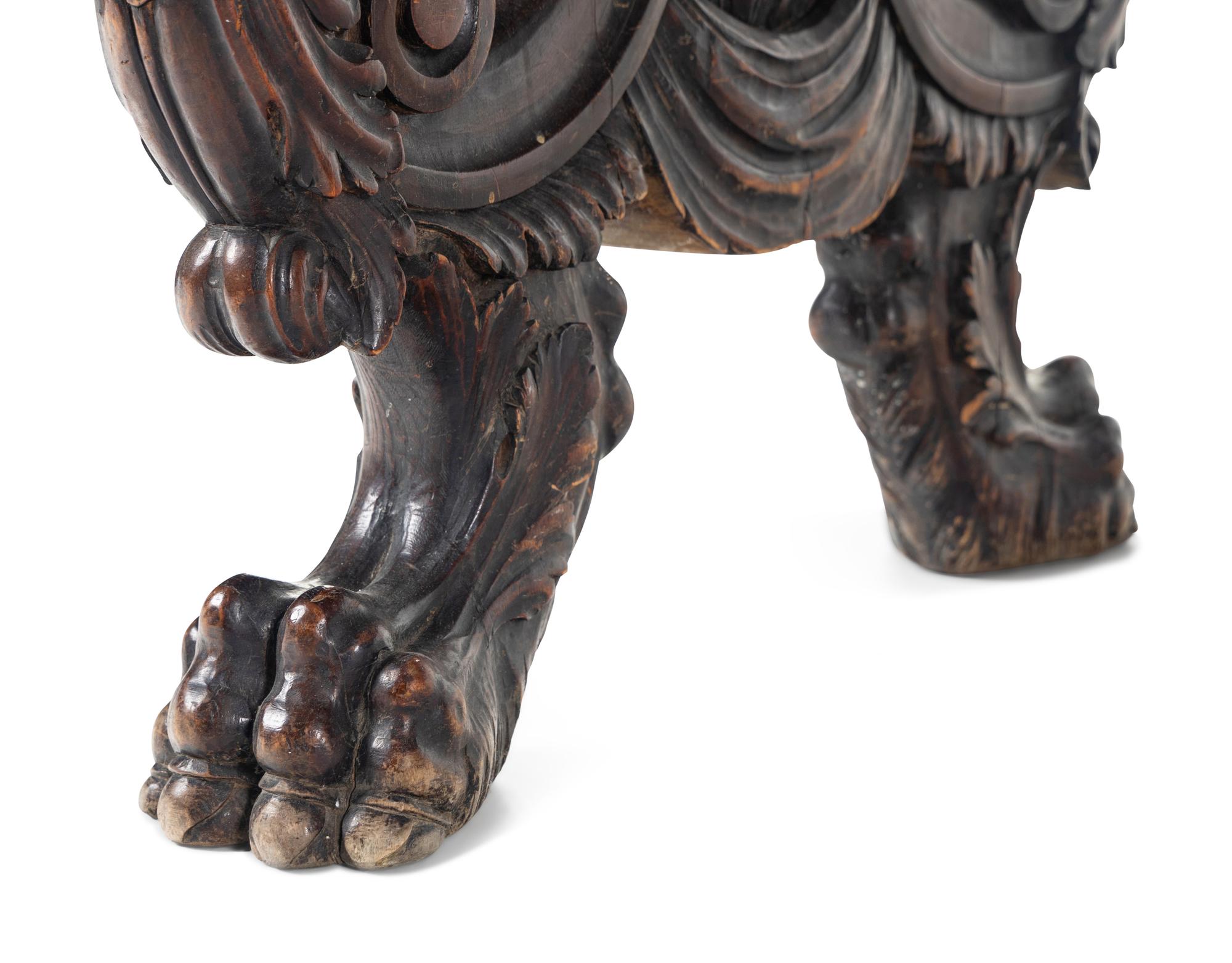 A Renaissance Revival Carved Walnut Trestle Table