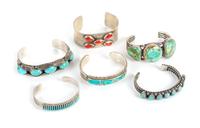 Six Southwestern Cuff Bracelets Length of largest 5 3/4 x opening 1 1/2 x width 5/8 inches