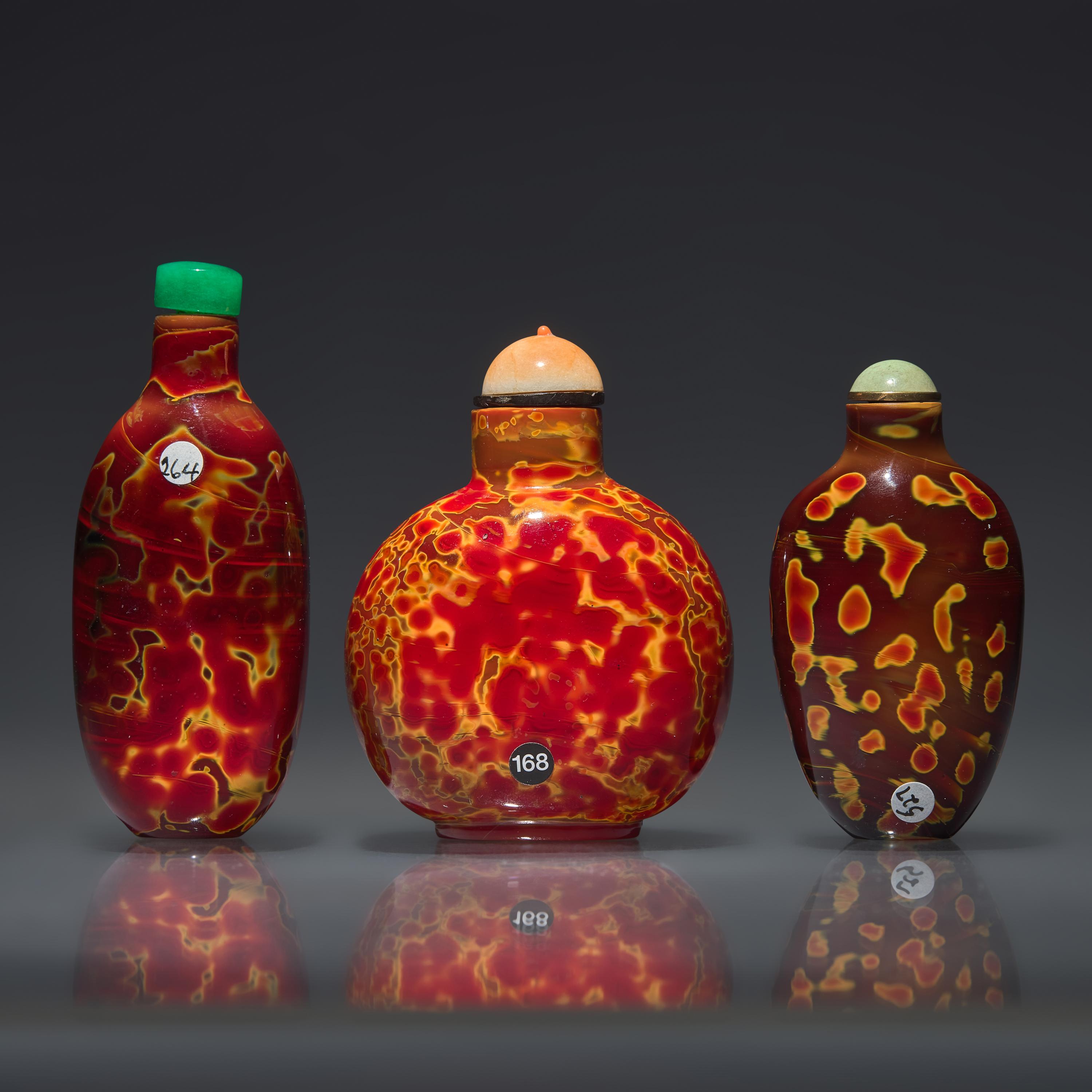 Three Chinese "Realgar" Glass Snuff Bottles, Qing Dynasty, 18th-19th Century — 清中期 雄黃料鼻煙壺三支