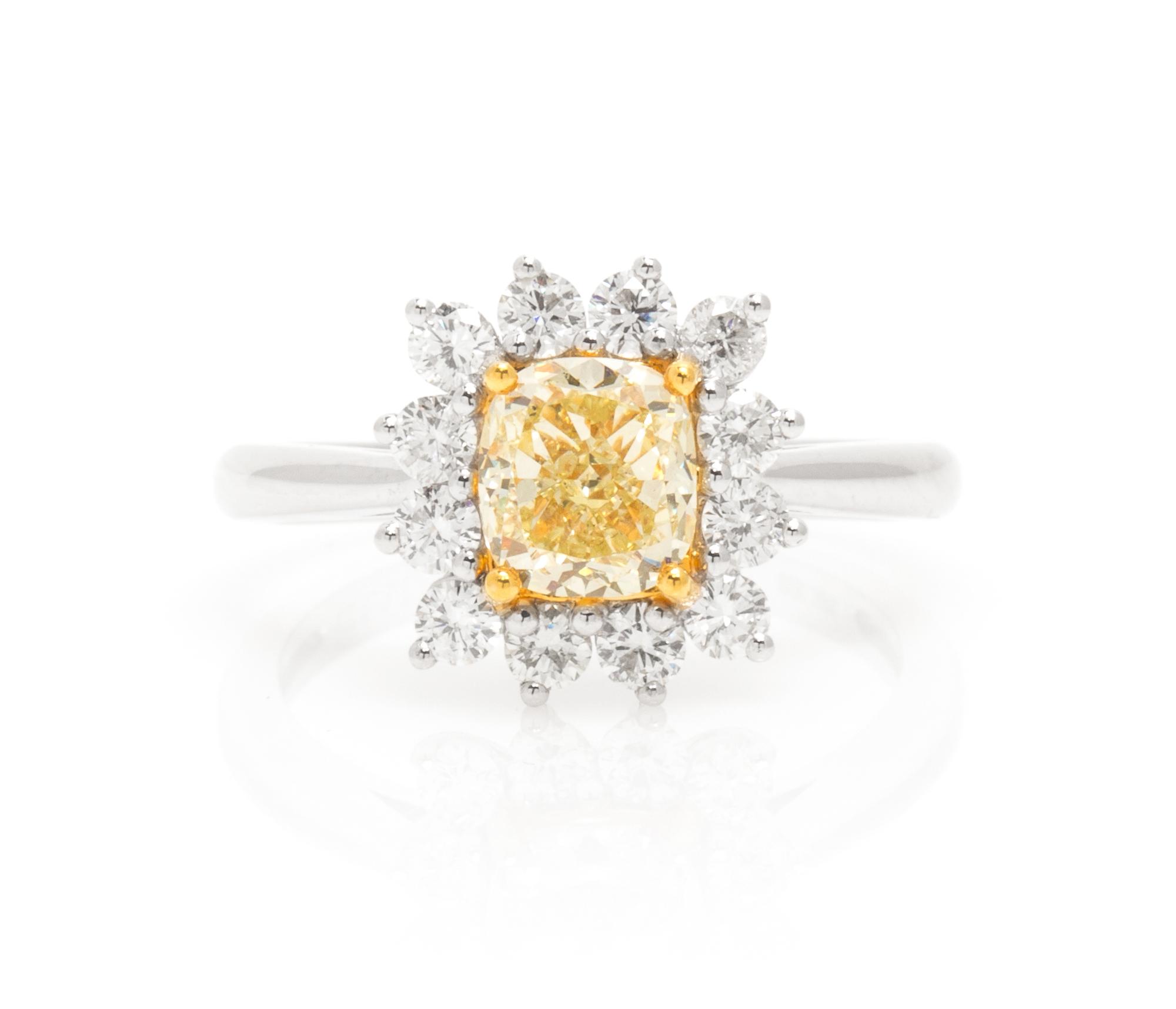 An 18 Karat White Gold, Colored Diamond and Diamond Ring, 3.10 dwts.