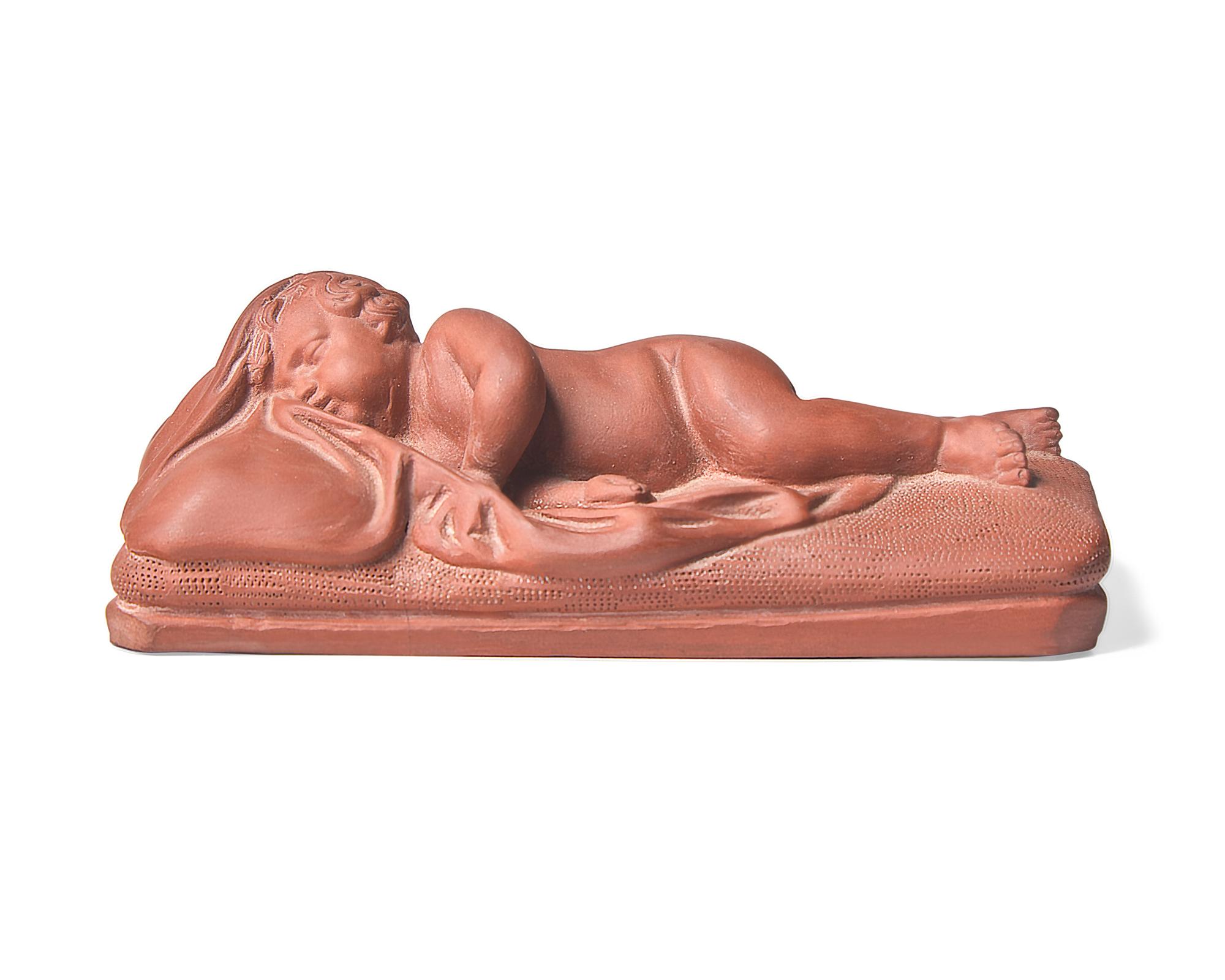 A Wedgwood Rosso Antico Sleeping Baby Figure