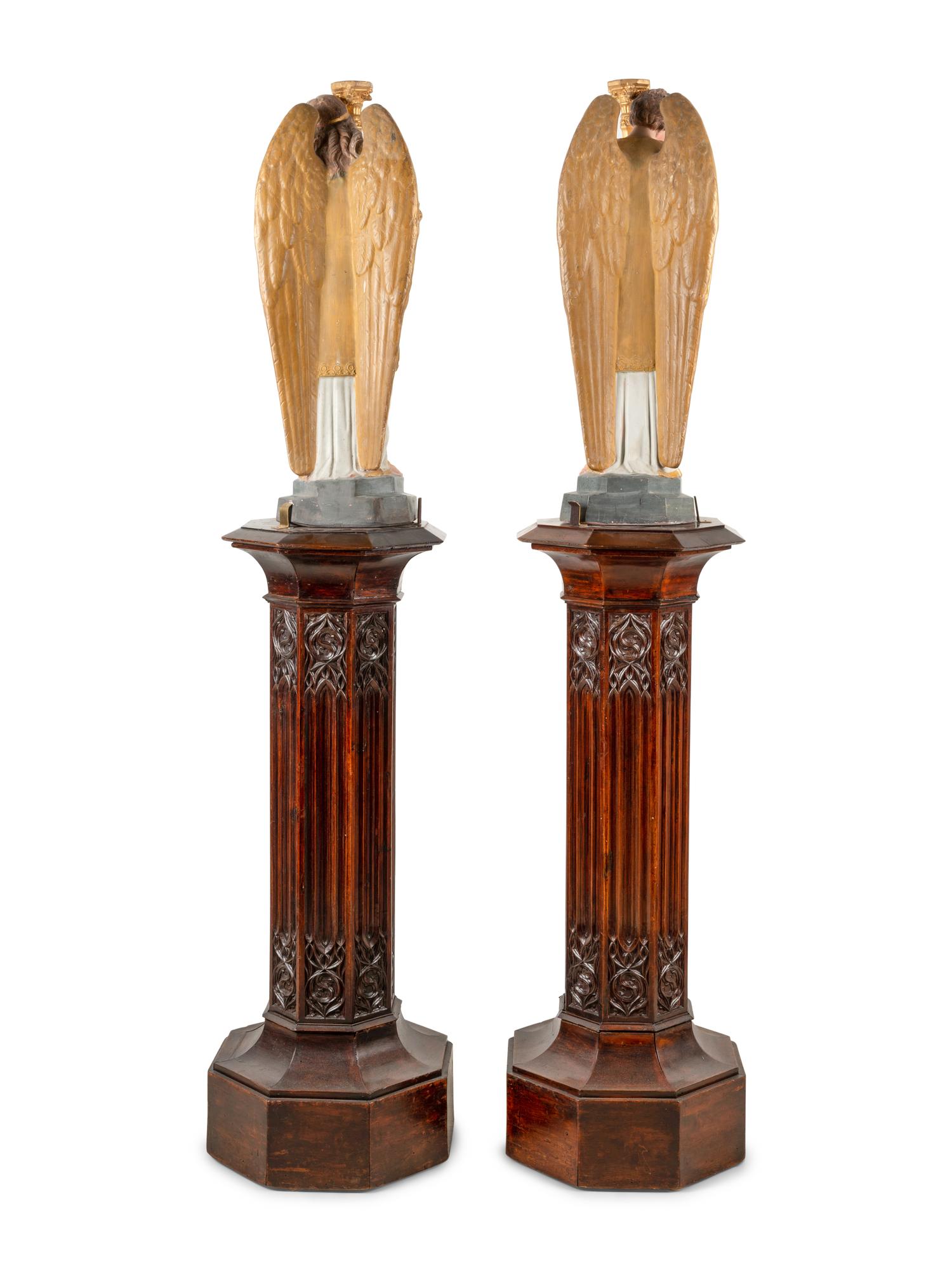 A Pair of Painted and Parcel Gilt Figural Altar Prickets with Associated Gothic Revival Pedestals