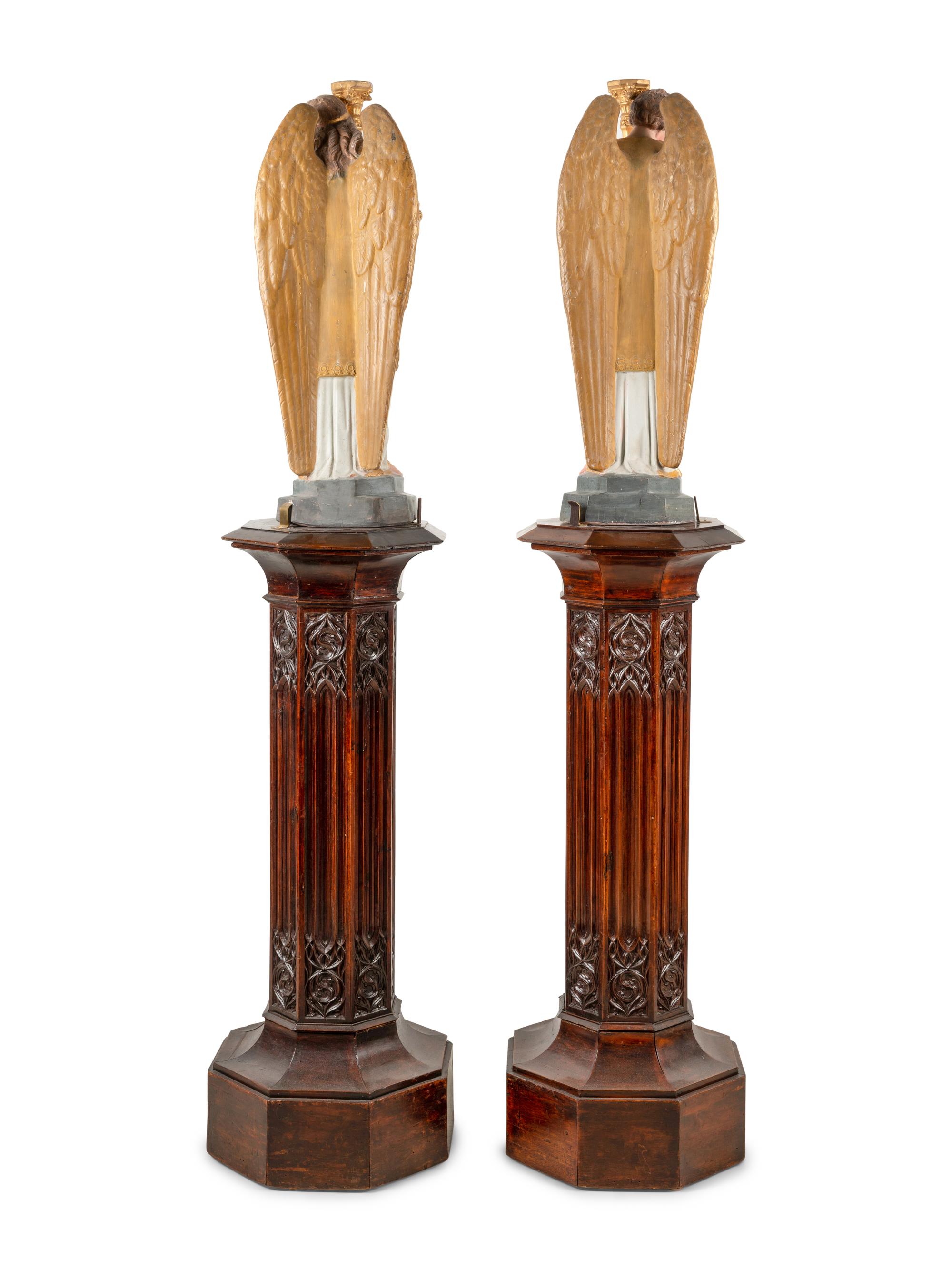A Pair of Painted and Parcel Gilt Figural Altar Prickets with Associated Gothic Revival Pedestals