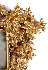 An Italian Baroque Style Carved Giltwood Mirror