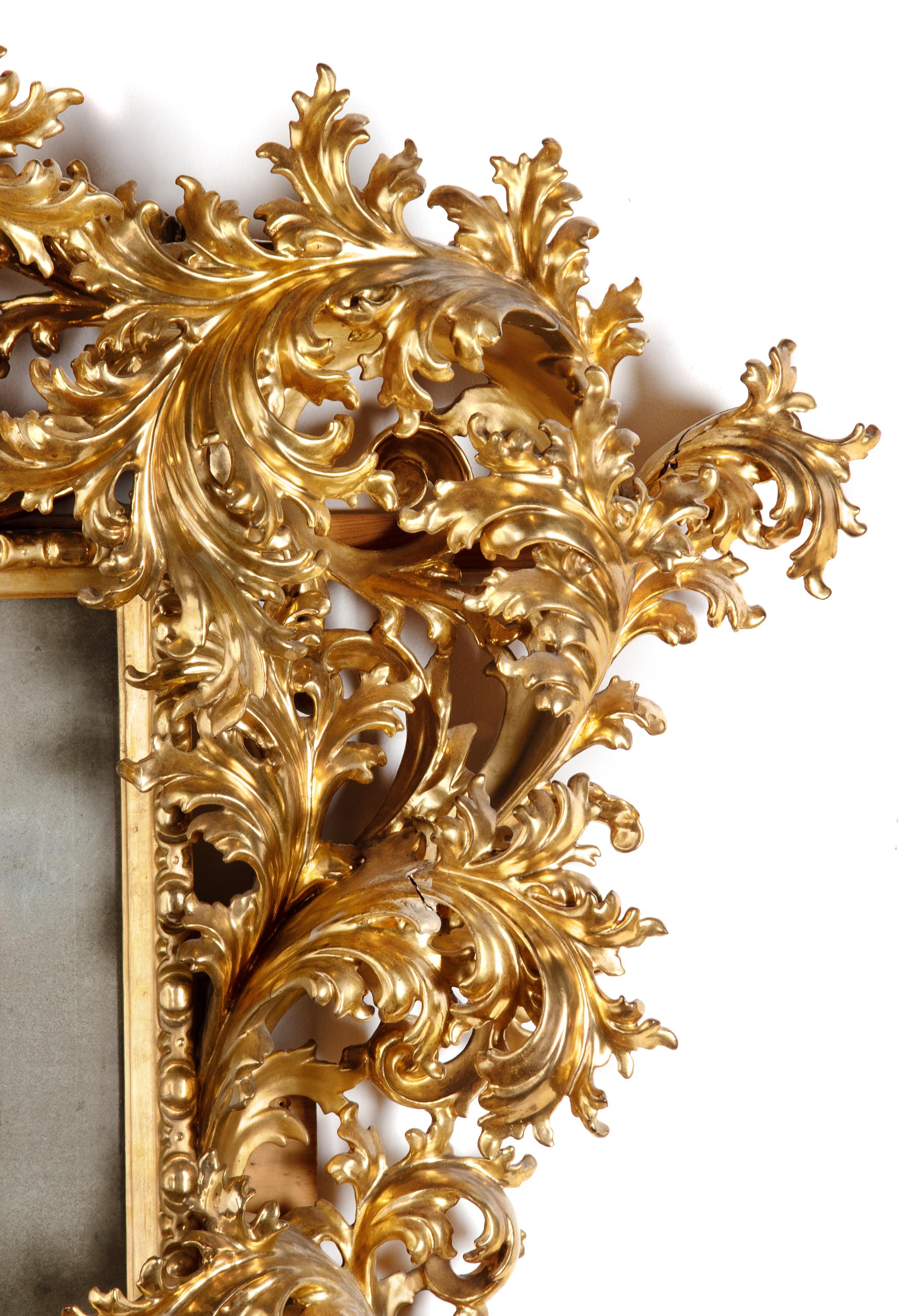 An Italian Baroque Style Carved Giltwood Mirror