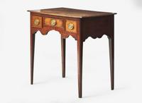 A George III provincial carved oak dressing table, late 18th century