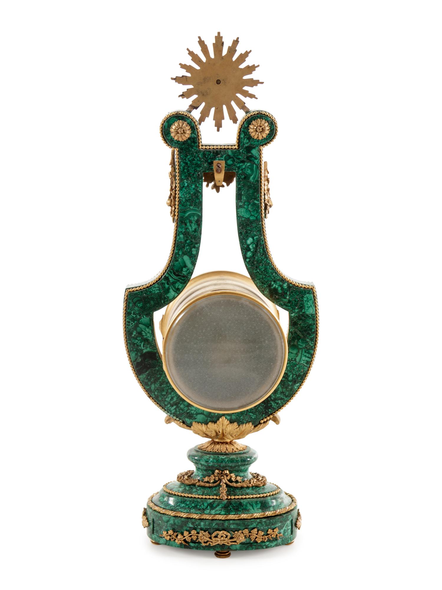 A Louis XIV Style Gilt Metal Mounted Malachite Veneered Harp Clock
