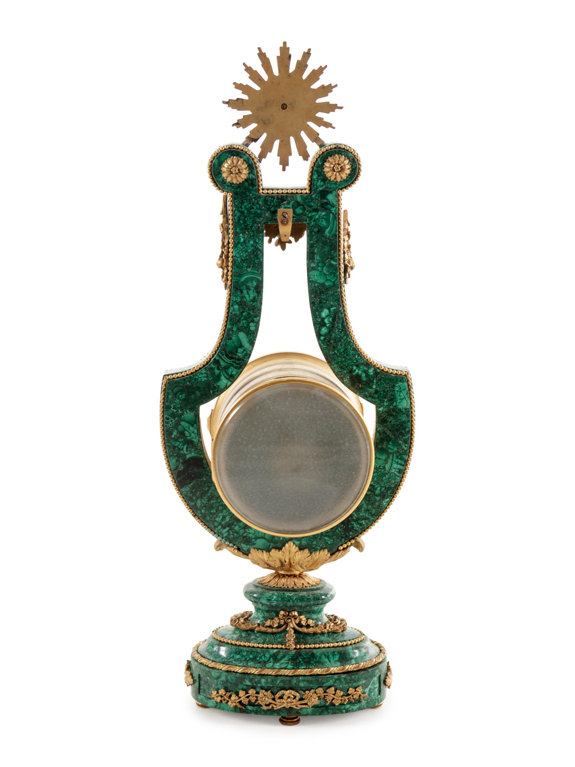 A Louis XIV Style Gilt Metal Mounted Malachite Veneered Harp Clock
