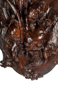 A Pair of Swiss Black Forest Carved Walnut Game Plaques