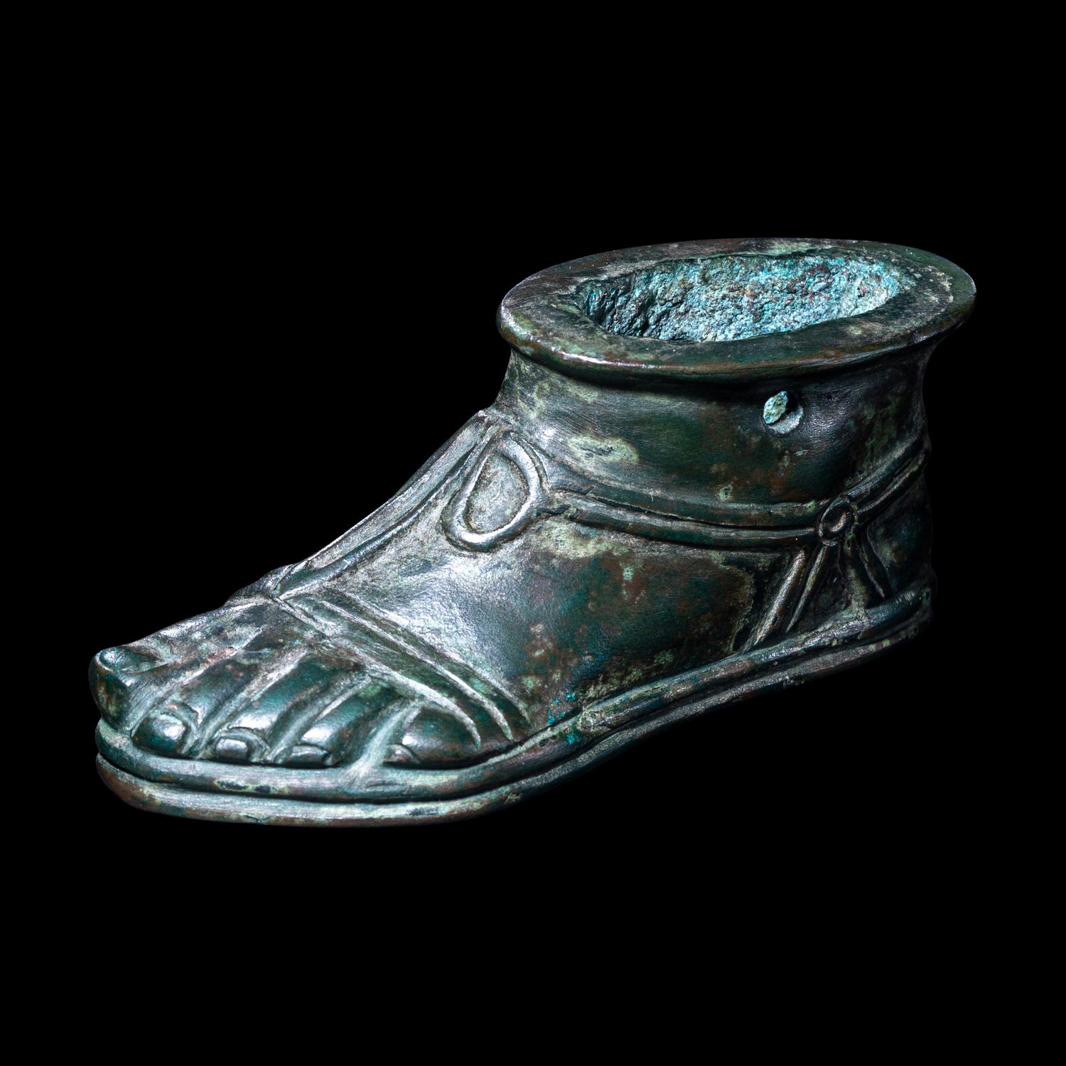 A Roman Bronze Lamp in the form of a Foot