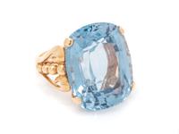 A 14 Karat Yellow Gold and Synthetic Blue Spinel Ring,