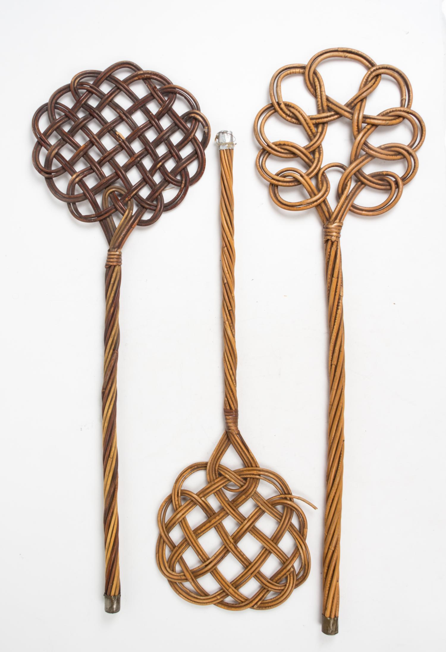 A Group of Three Wicker Rug Beaters Length of longest 34 inches.