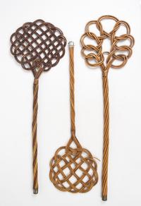A Group of Three Wicker Rug Beaters Length of longest 34 inches.