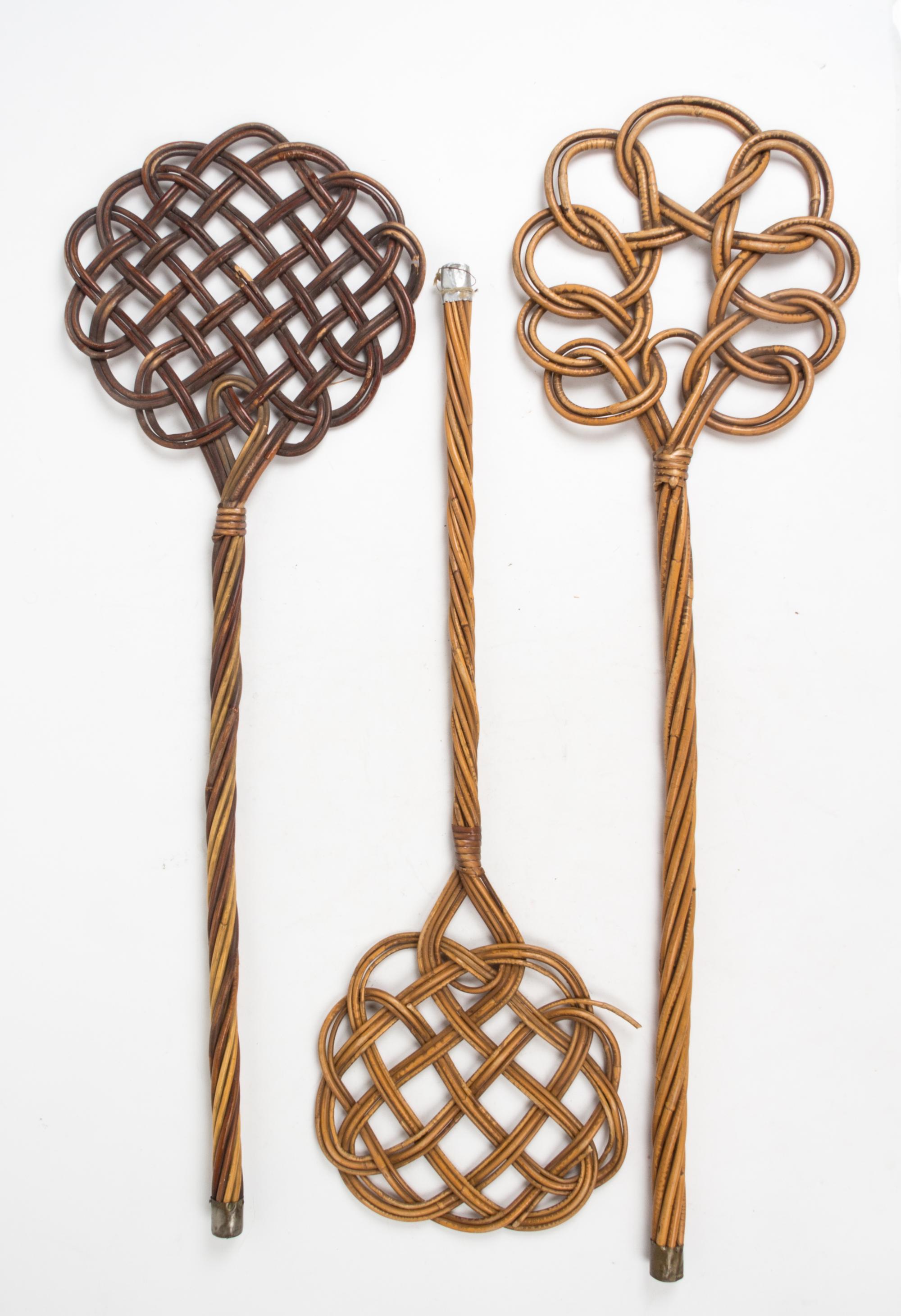 A Group of Three Wicker Rug Beaters Length of longest 34 inches.