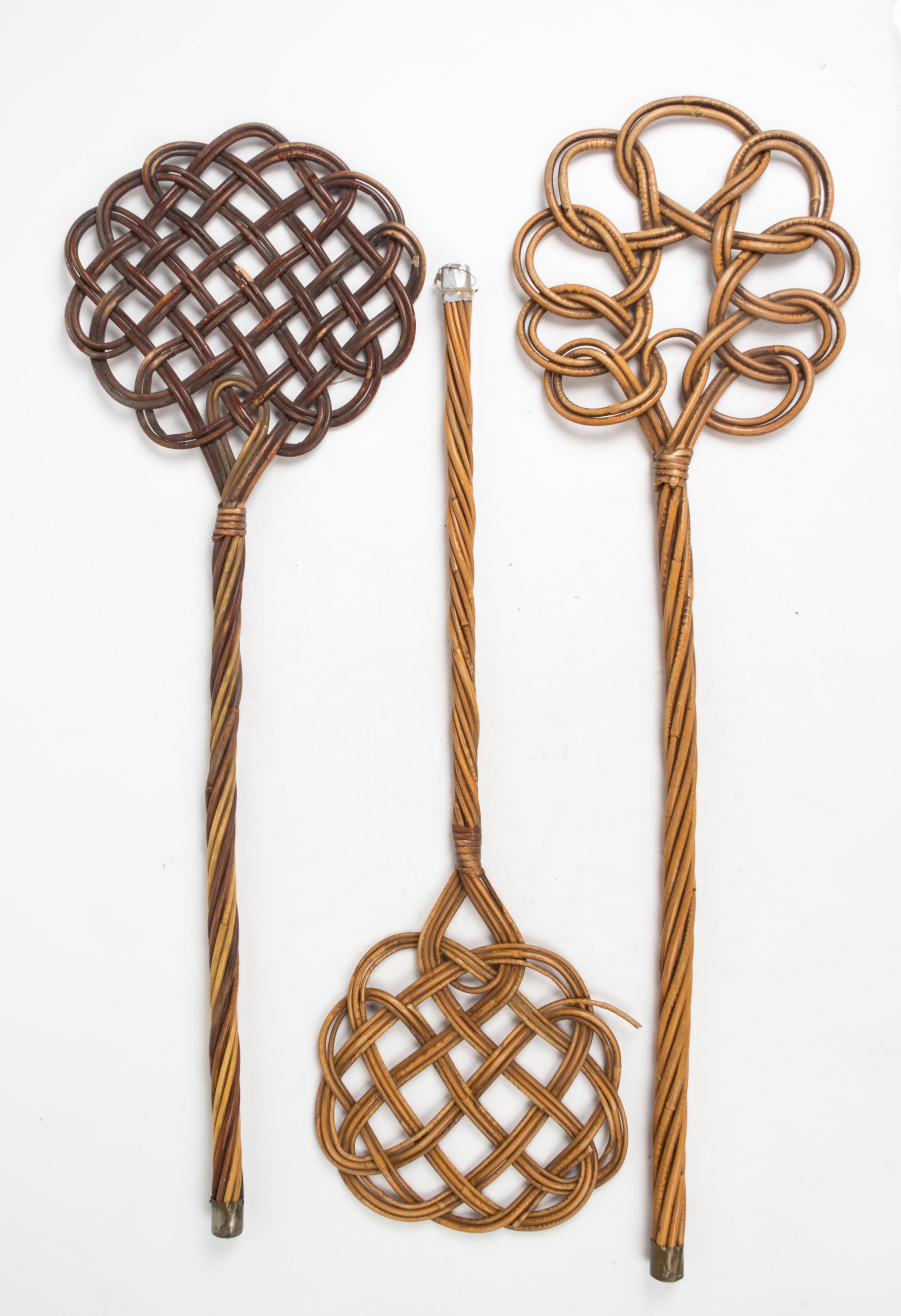 A Group of Three Wicker Rug Beaters Length of longest 34 inches.