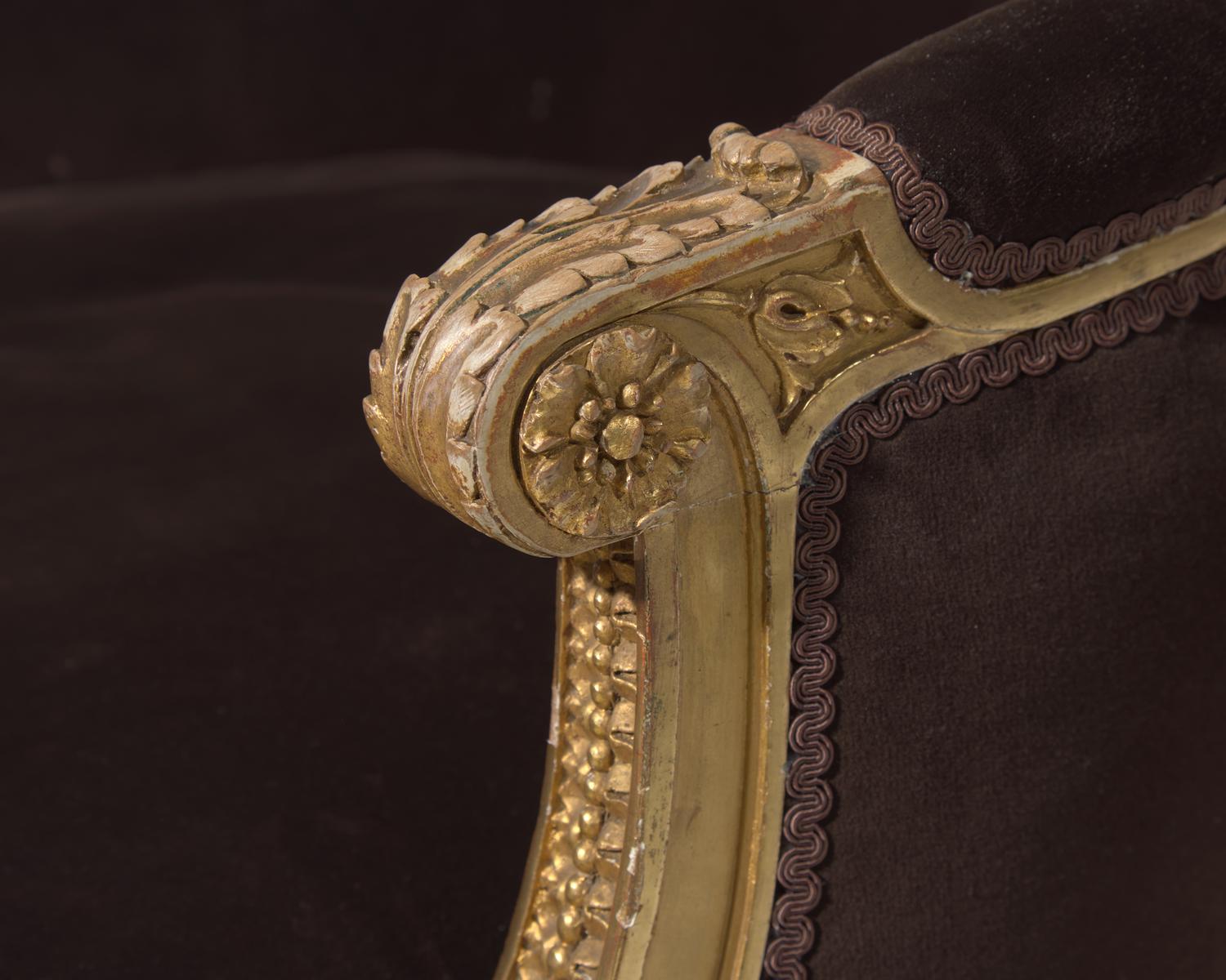 A Louis XVI style giltwood bergère, probably 19th century