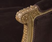 A Louis XVI style giltwood bergère, probably 19th century