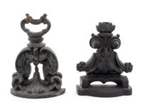 Two Cast Iron Doorstops Height of tallest 9 1/4 inches.