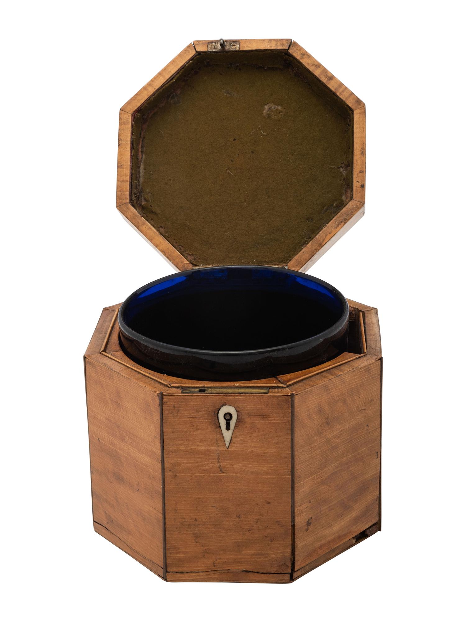 A George III Octagonal Walnut Tea Caddy with Satinwood Inlay