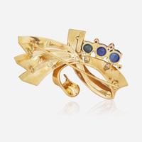 A 14K Yellow Gold, Sapphire, and Rubies Brooch Reflections By Trabert & Hoeffer Mauboussin