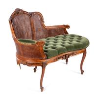 A Louis XV Style Caned Settee