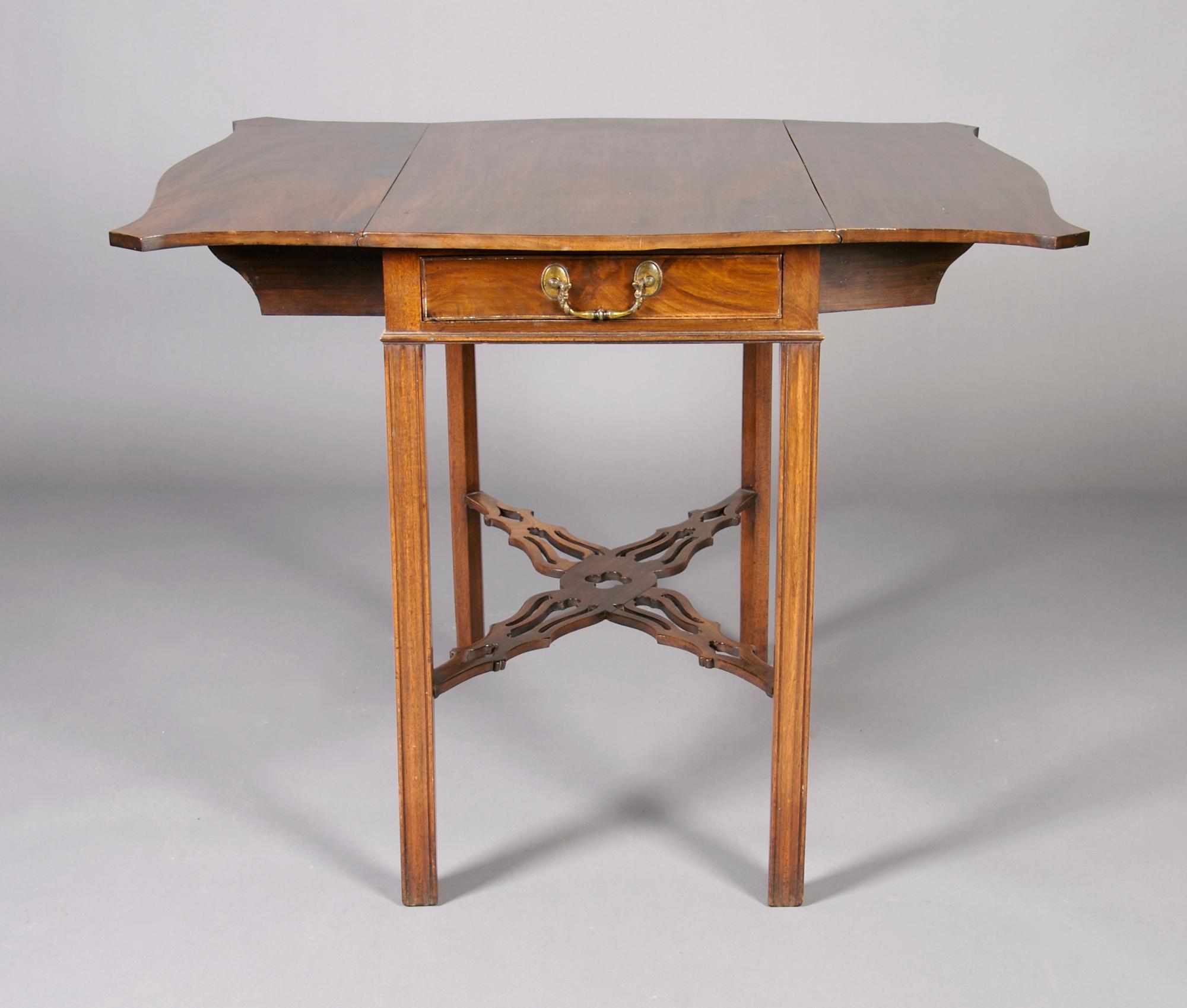 A George III Style Mahogany Pembroke Table, Height 28 1/2 x width 18 x depth 31 1/4 inches closed.