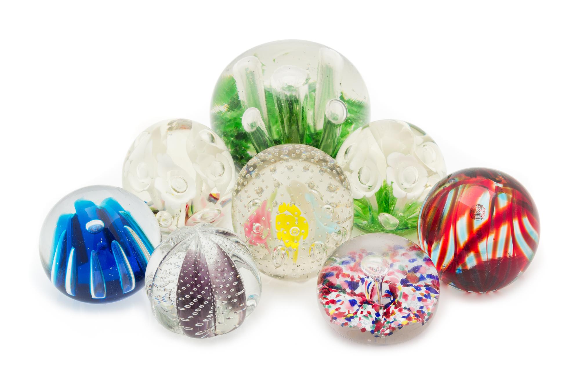 A Collection of Glass Paperweights Diameter of largest 5 1/2 inches