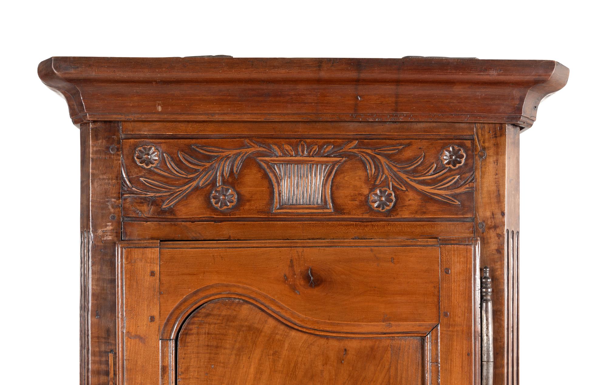 A Louis XV Provincial Walnut Cabinet