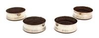 Four English Silver Bottle Coasters, Broadway & Co., Birmingham, 1982, having treen bottoms