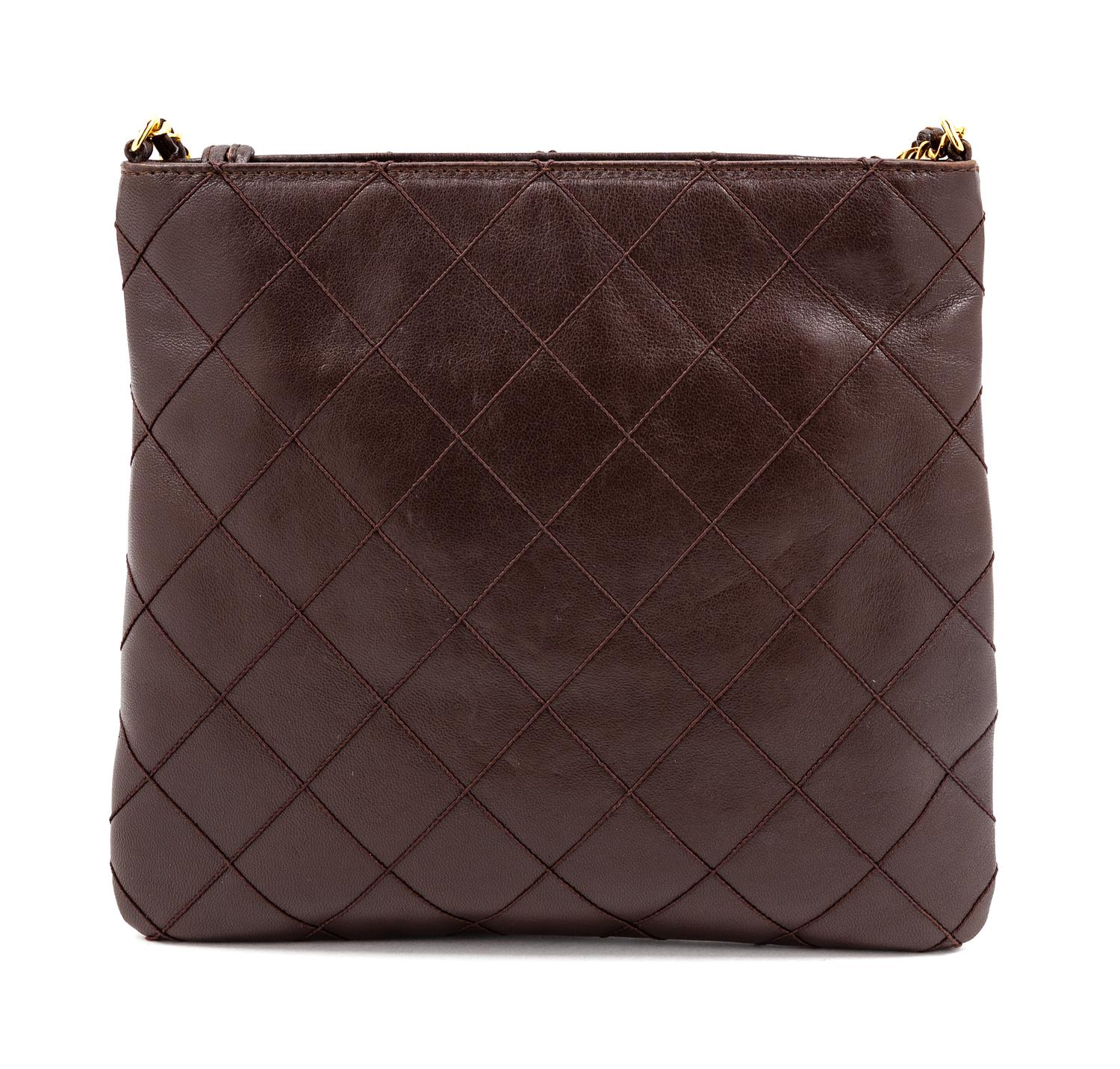 A Chanel Dark Brown Quilted Cross Body Bag, 7.5" H x 8.25" W; Strap drop: 19".