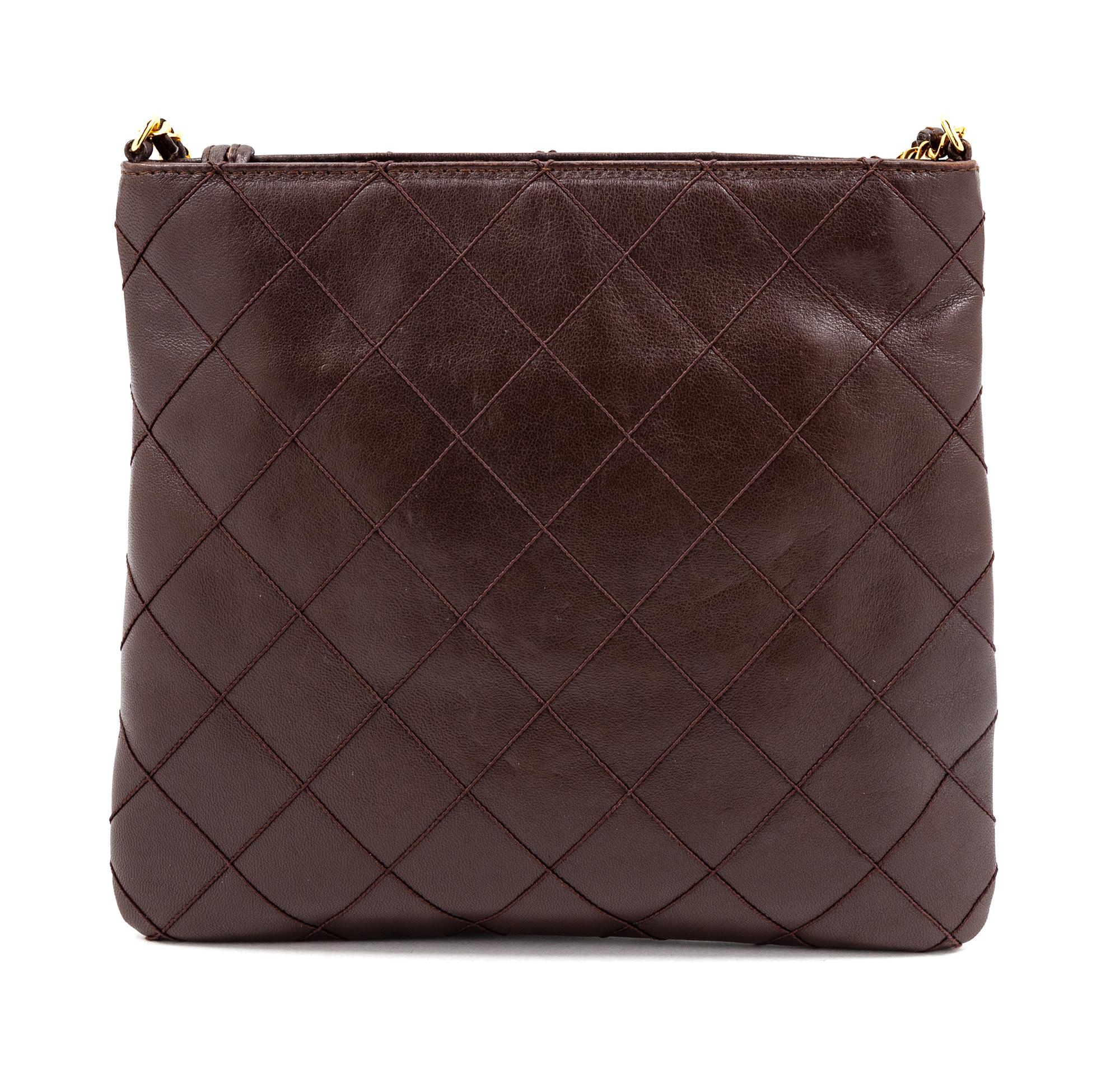A Chanel Dark Brown Quilted Cross Body Bag, 7.5" H x 8.25" W; Strap drop: 19".