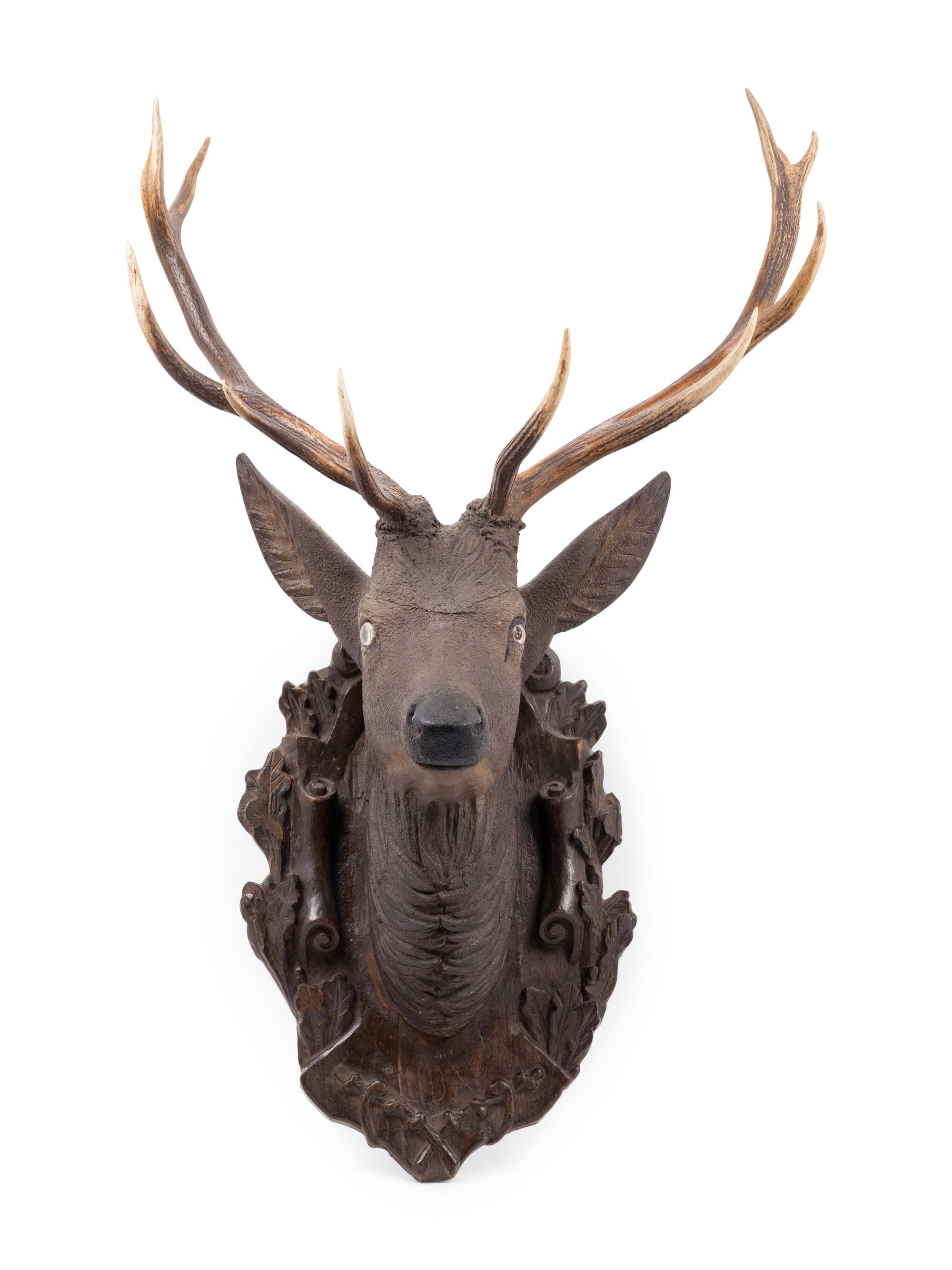A Black Forest Carved Stag Head