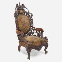 A Rococo revival carved oak fire company armchair circa 1860
