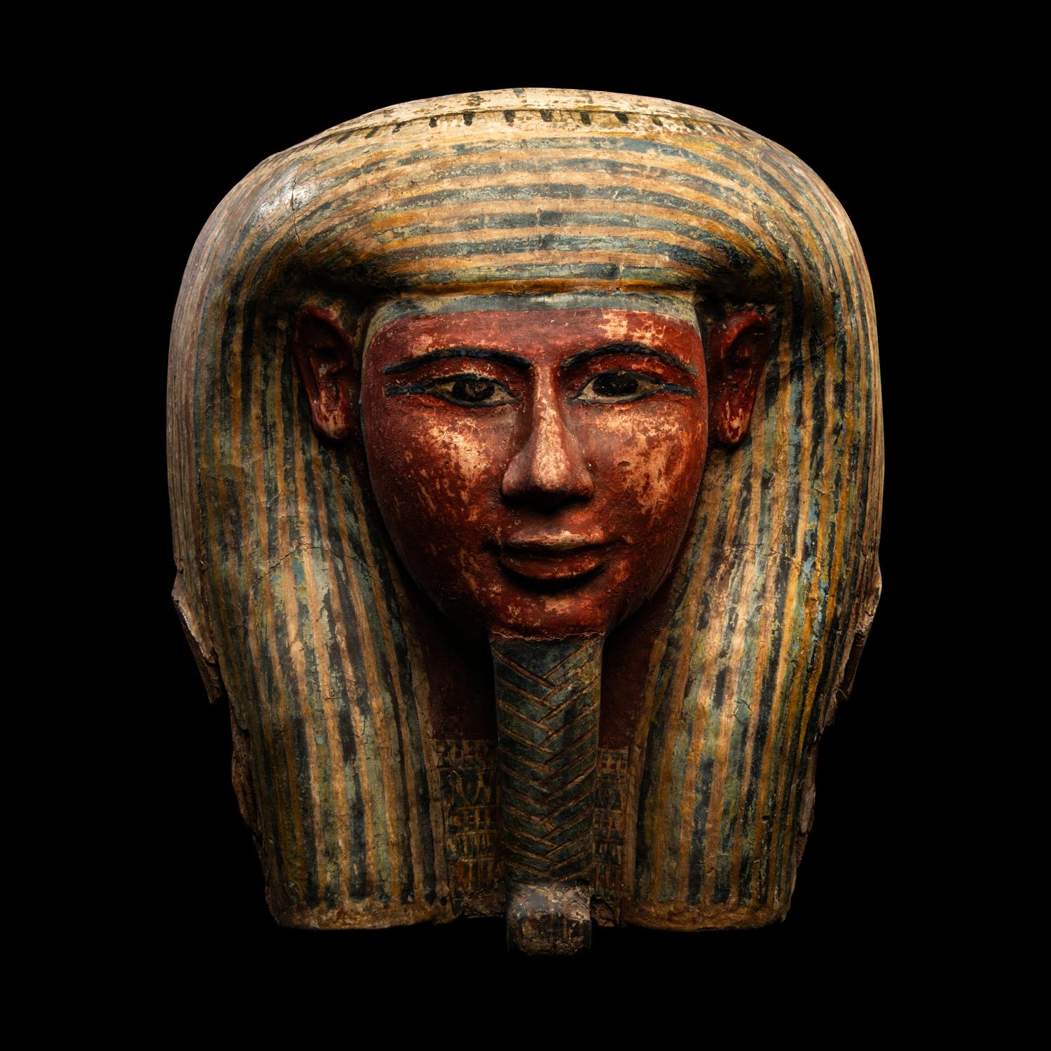 An Egyptian Polychrome Wood Mummy Mask