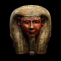 An Egyptian Polychrome Wood Mummy Mask