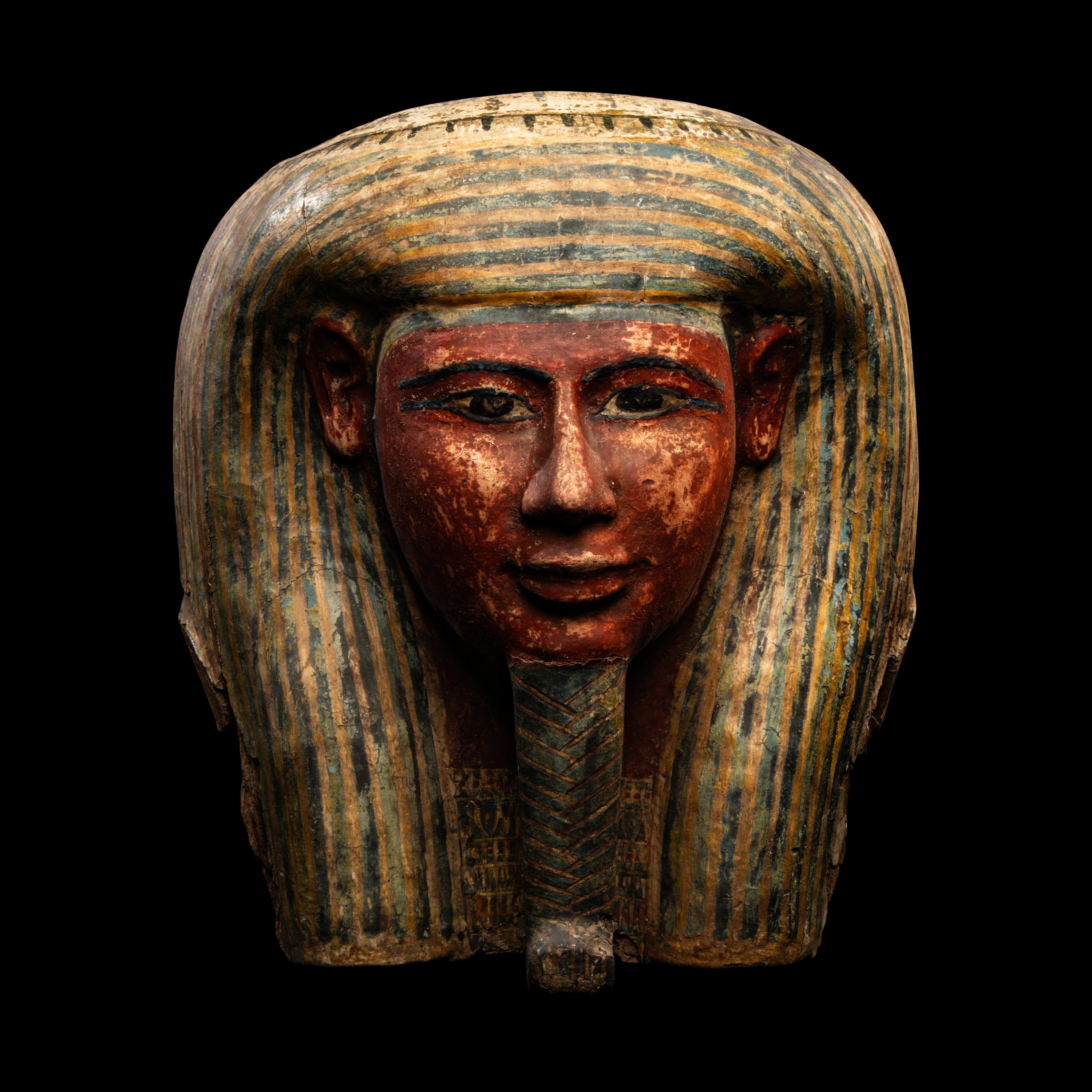 An Egyptian Polychrome Wood Mummy Mask
