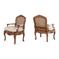 A Pair of Louis XV Style Caned Walnt Fauteuils