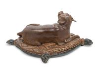 An Italian Carved and Painted Model of a Recumbent Dog