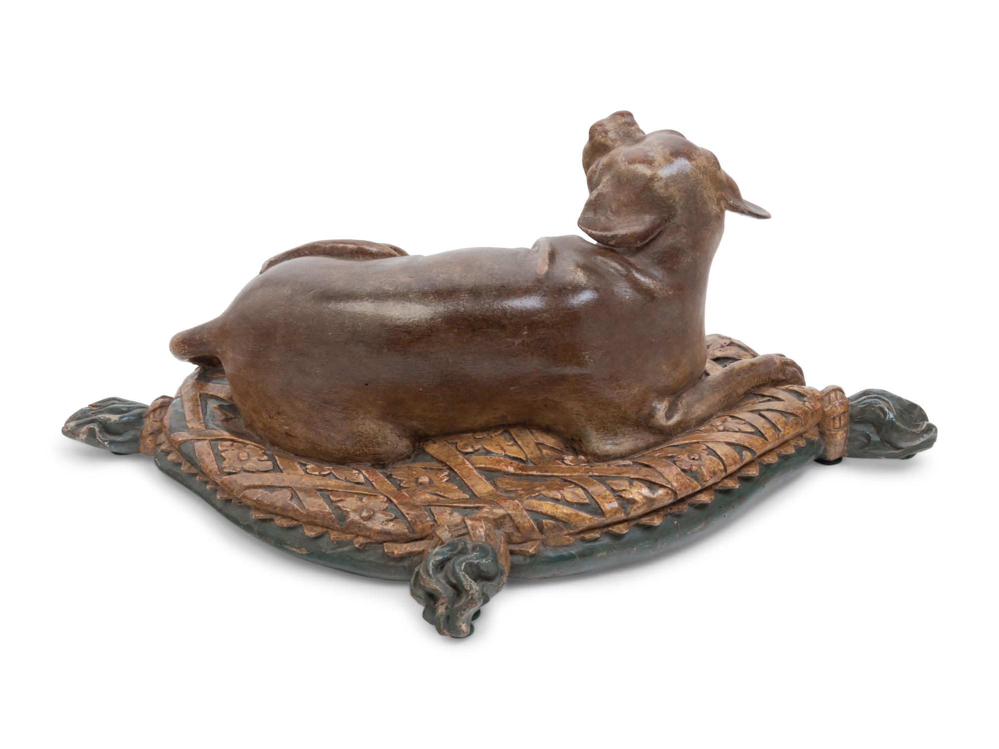 An Italian Carved and Painted Model of a Recumbent Dog