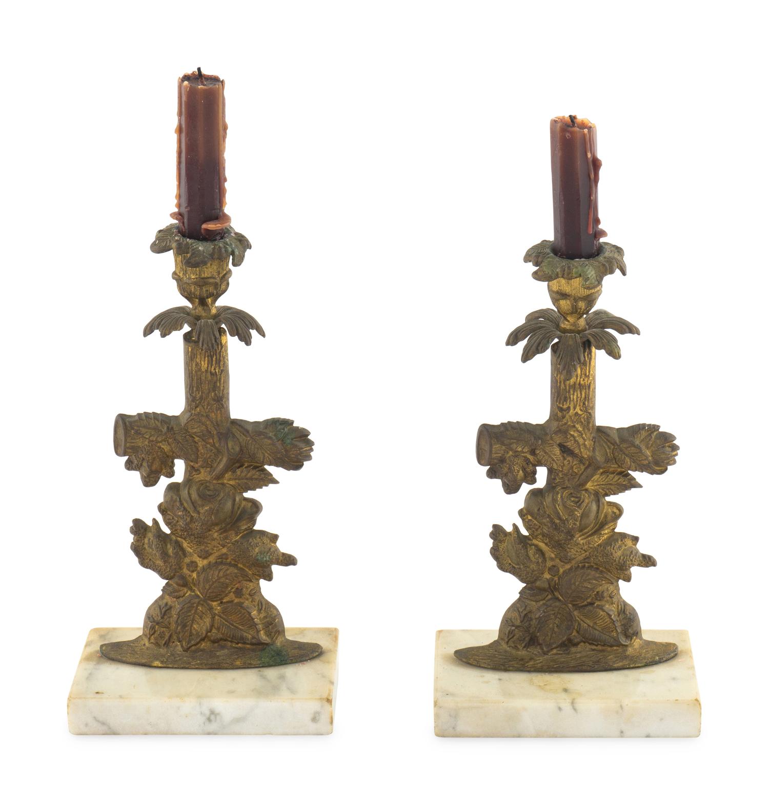 A Pair of Gilt Metal Candlesticks